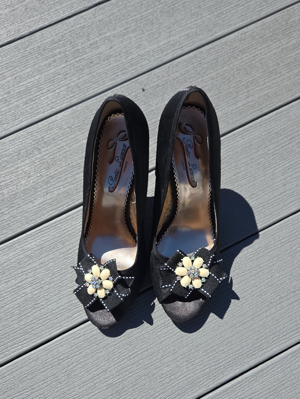 Pelle Moda Black Suede Peep-Toe Heels with Cream Floral Accent